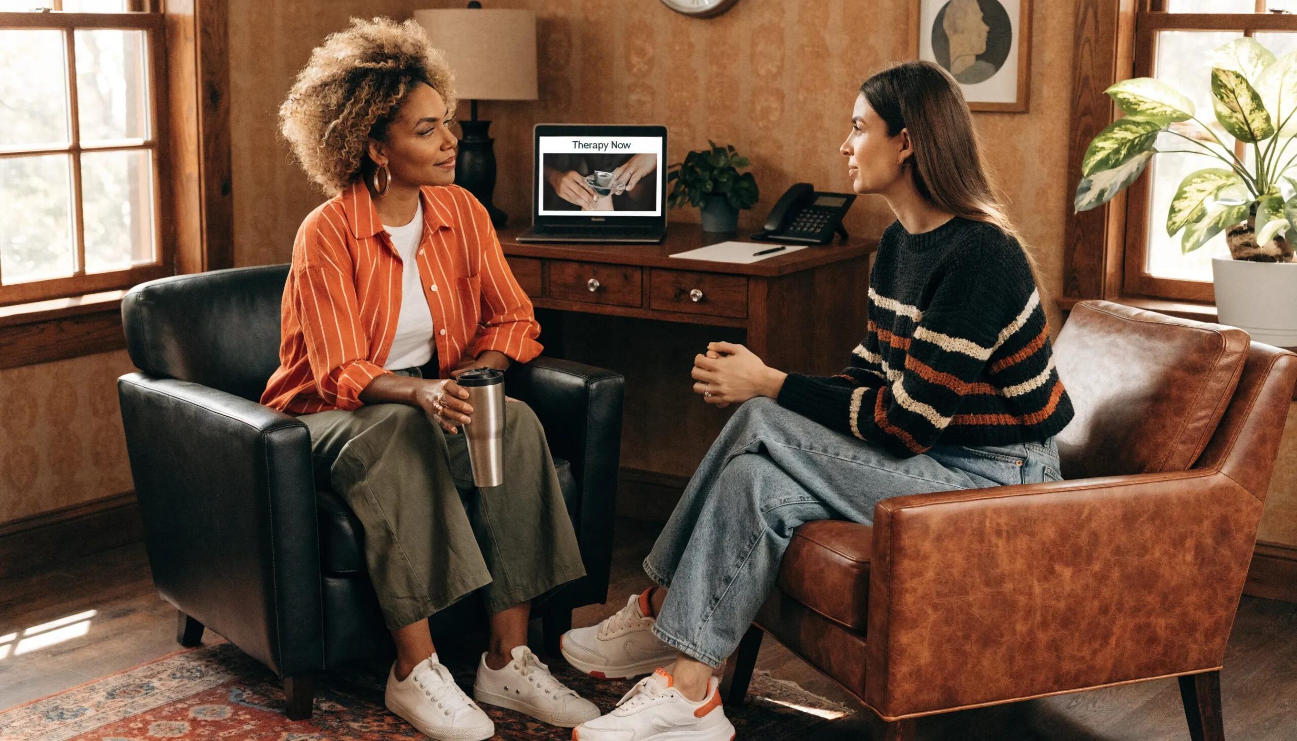 Therapist interacting with client, illustrating the credibility gained through customized web design
